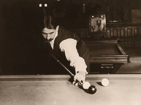 Man playing billiards (B&W sepia tone)