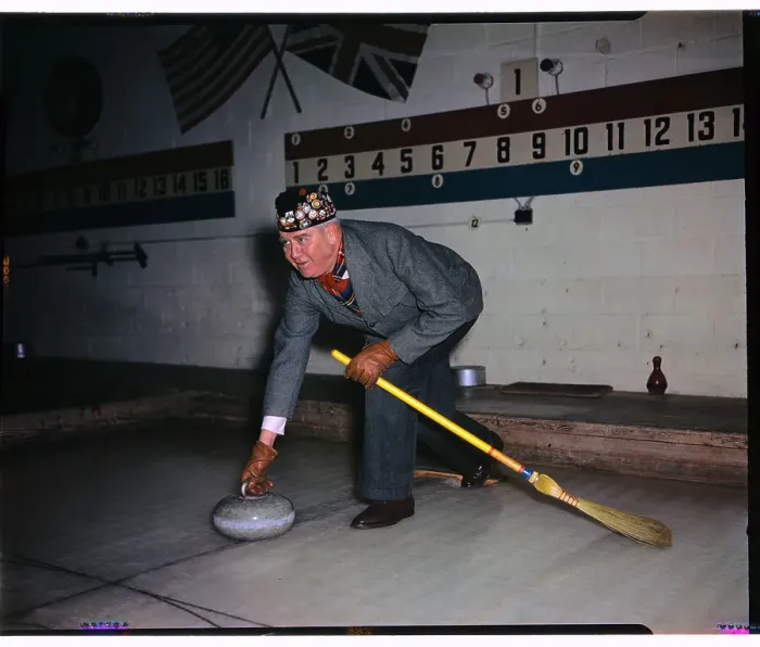 Framed Print : Man Playing the Game of Curling Framed Print : Man Playing the Game of Curling