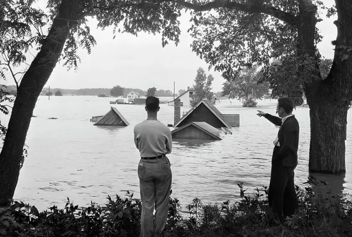 Framed Print : Man Pointing to Attic Flooded by River Framed Print : Man Pointing to Attic Flooded by River