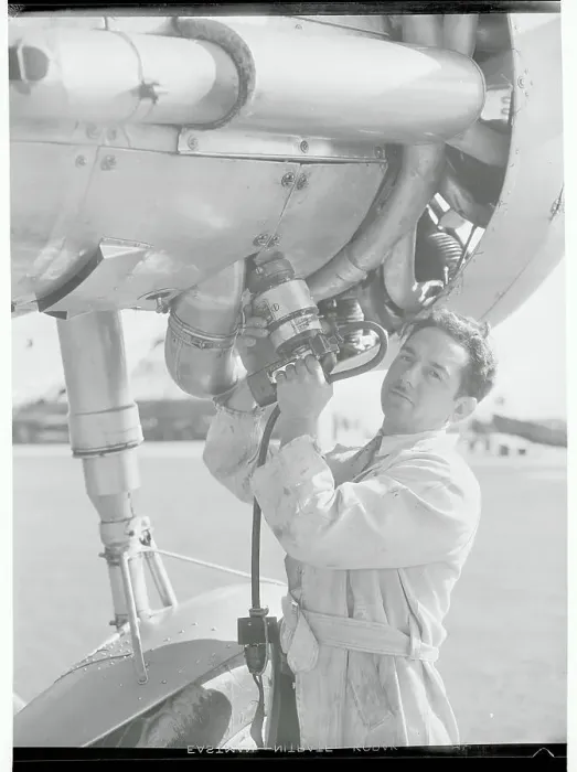 Framed Print : Man with Portable Airplane Starter Framed Print : Man with Portable Airplane Starter