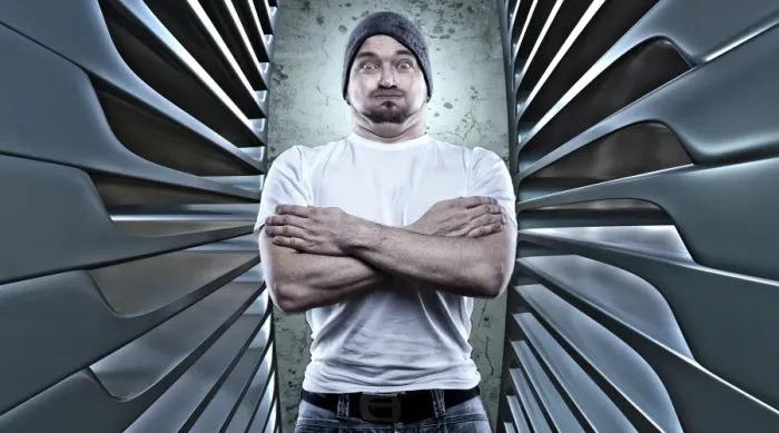 Framed Print : Man posing like a macho with his arms crossed