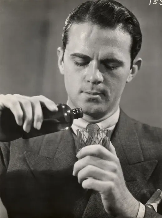 Framed Print : Man pouring medicine into glass Framed Print : Man pouring medicine into glass