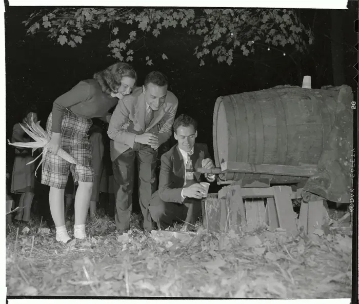 Framed Print : Man Pouring Sweet Cider from Barrel for Couple Framed Print : Man Pouring Sweet Cider from Barrel for Couple