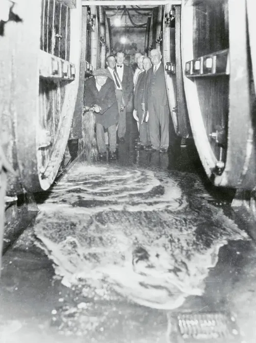 Framed Print : Man Pouring Wine into Sewer Framed Print : Man Pouring Wine into Sewer