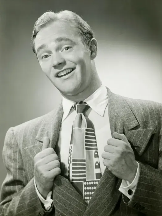 Framed Print : Man pulling sides of jacket apart to reveal tie, portrait Framed Print : Man pulling sides of jacket apart to reveal tie, portrait