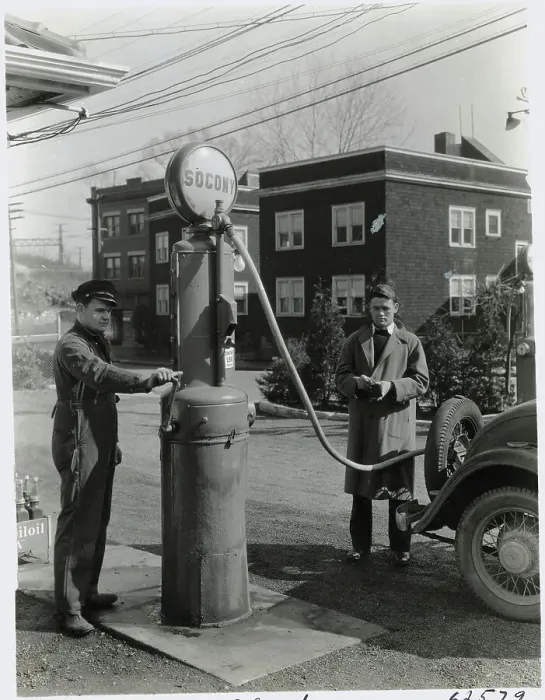 Framed Print : Man Pumping Gas Framed Print : Man Pumping Gas
