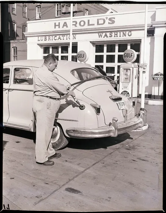 Framed Print : Man Putting Gas in Automobile Framed Print : Man Putting Gas in Automobile