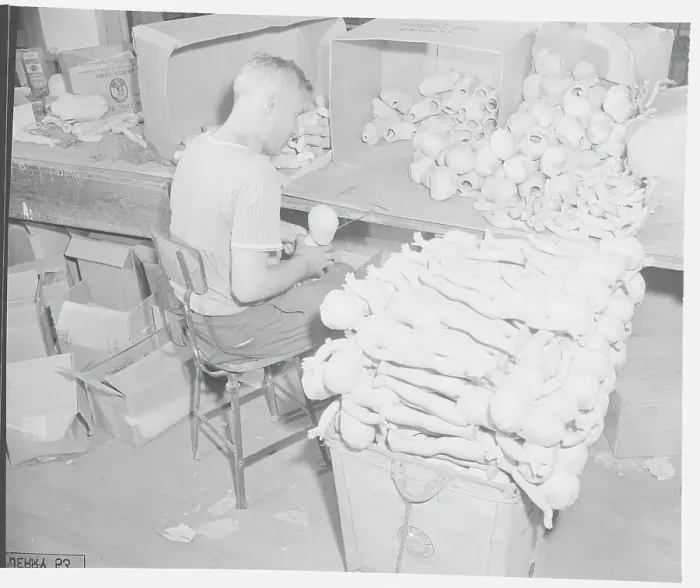 Framed Print : Man Putting Toys Together