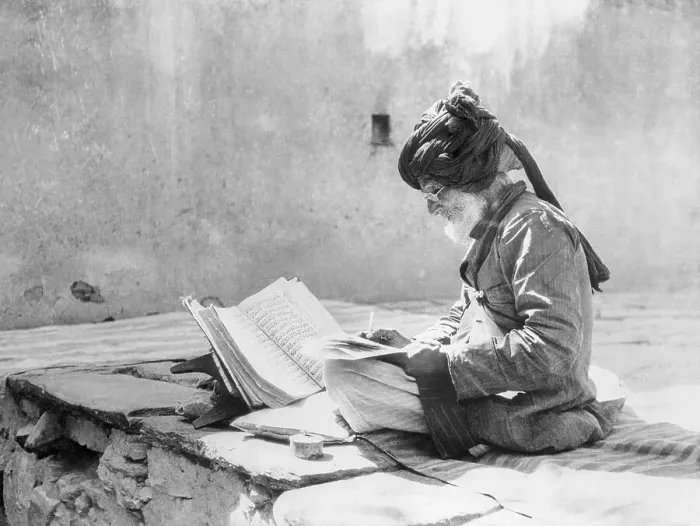 Framed Print : Man Reading the Koran Framed Print : Man Reading the Koran
