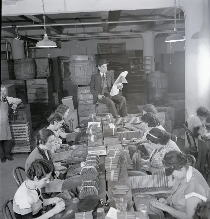 Framed Print : Man Reading Newspaper to Cigar Workers Framed Print : Man Reading Newspaper to Cigar Workers