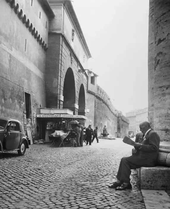Framed Print : Man Reading Newspaper by Cobblestone Street Framed Print : Man Reading Newspaper by Cobblestone Street