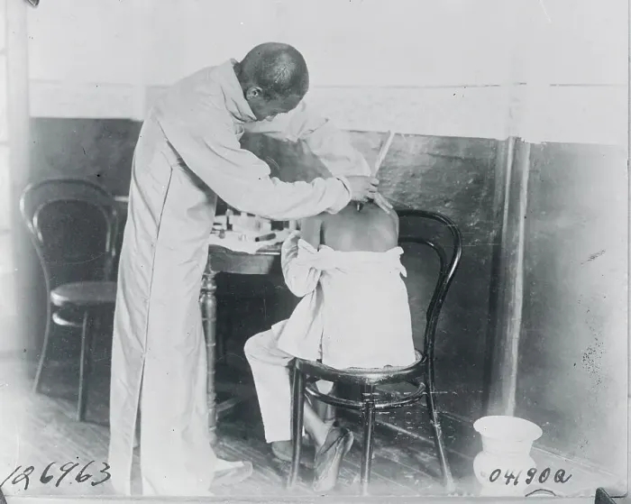 Framed Print : Man Receiving Aid from Chinese Druggist Framed Print : Man Receiving Aid from Chinese Druggist