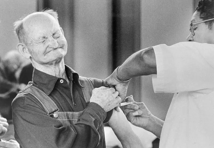 Framed Print : Man Receiving Flu Shot Framed Print : Man Receiving Flu Shot