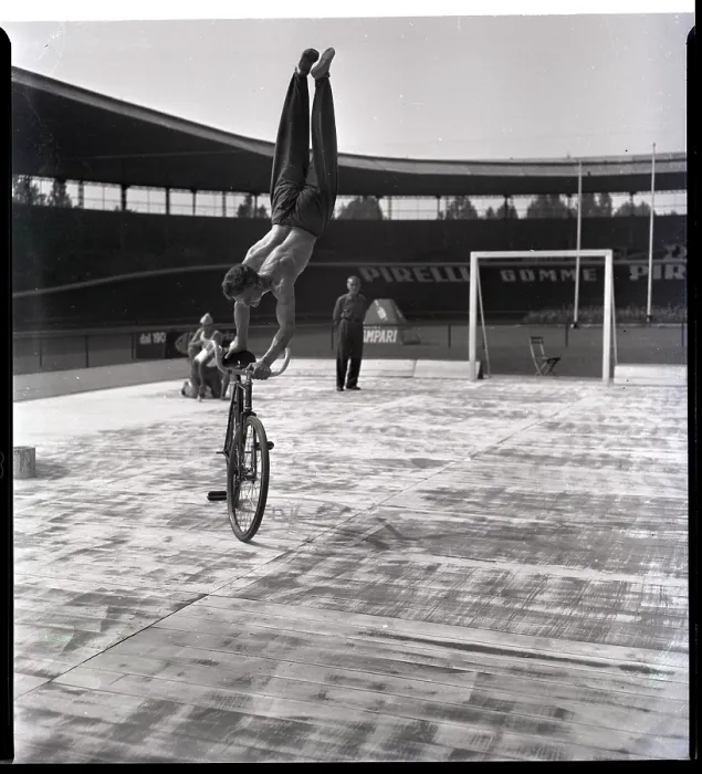 Framed Print : Man Riding Bicyce Doing Handstand Framed Print : Man Riding Bicyce Doing Handstand