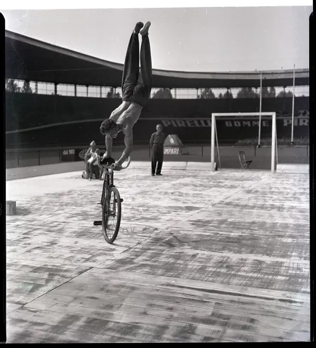 Framed Print : Man Riding Bicyce Doing Handstand Framed Print : Man Riding Bicyce Doing Handstand