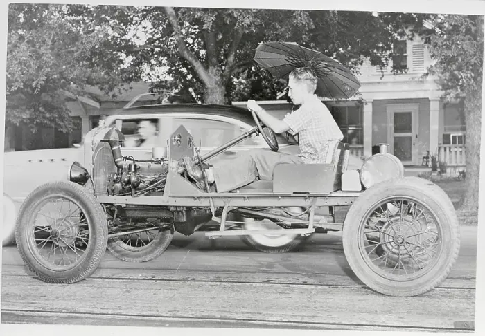 Framed Print : Man Riding in Open Framed Car Framed Print : Man Riding in Open Framed Car