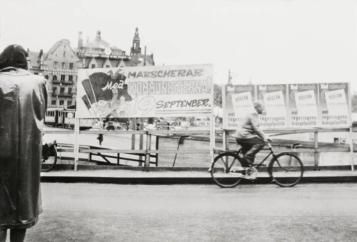Framed Print : Man Riding Past Communist Posters Framed Print : Man Riding Past Communist Posters