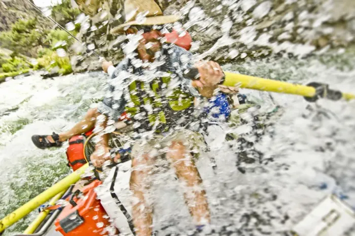 Framed Print : Man rowing raft through splashing rapids Framed Print : Man rowing raft through splashing rapids