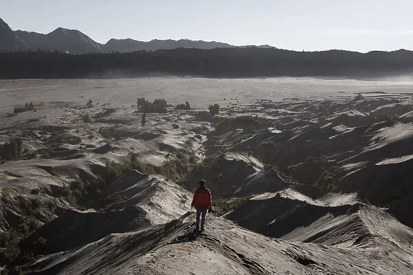 One man and sand dune at mount Bromo