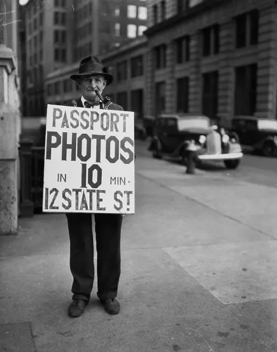 Framed Print : Man In Sandwich Sign For Passport Photos Framed Print : Man In Sandwich Sign For Passport Photos