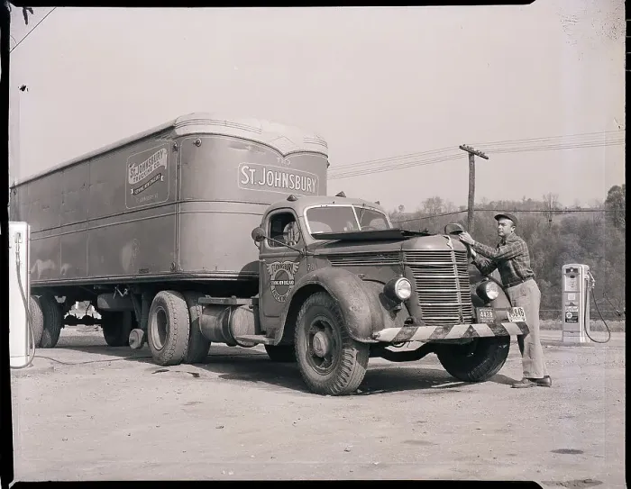 Framed Print : Man Servicing Truck at Gas Station Framed Print : Man Servicing Truck at Gas Station