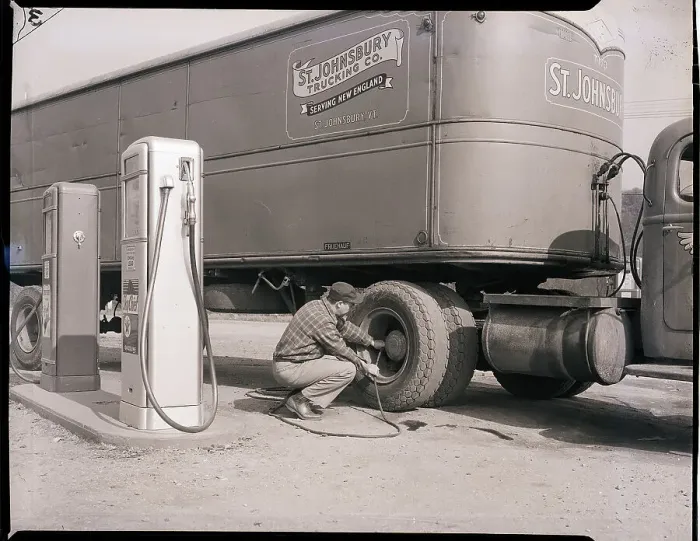 Framed Print : Man Servicing Truck at Gas Station
