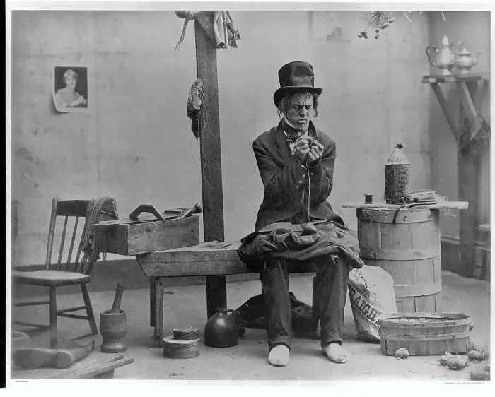 Framed Print : Man Sewing Button Framed Print : Man Sewing Button