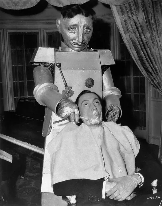 Framed Print : Man Being Shaved by Robot Barber Framed Print : Man Being Shaved by Robot Barber