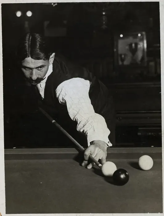 Framed Print : Man Shooting Pool Aimimg At Ball