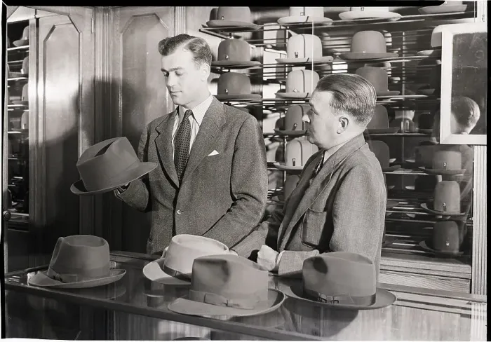 Framed Print : Man Shopping for Hat Framed Print : Man Shopping for Hat