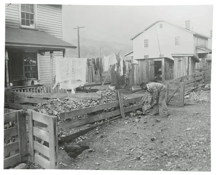 Framed Print : Man Shoveling Framed Print : Man Shoveling