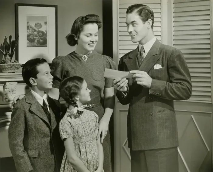 Framed Print : Man showing cheque or telegram to family Framed Print : Man showing cheque or telegram to family