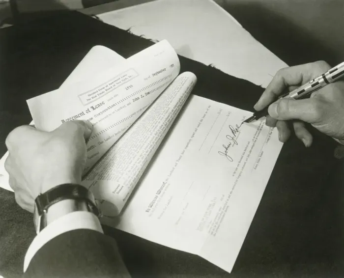 Framed Print : Man signing lease, close up of hands Framed Print : Man signing lease, close up of hands