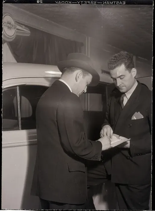 Framed Print : Man Signing Paper in Process Framed Print : Man Signing Paper in Process