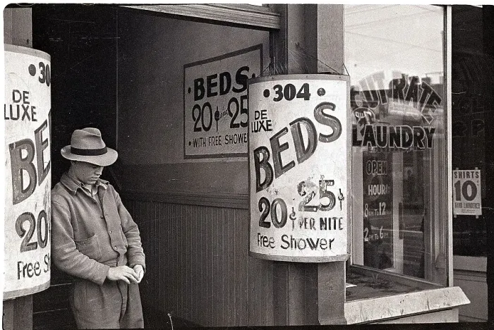 Framed Print : Man By Signs For Beds Framed Print : Man By Signs For Beds