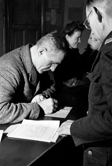 Framed Print : Man Signs Identity Card In Soviet Sector Framed Print : Man Signs Identity Card In Soviet Sector