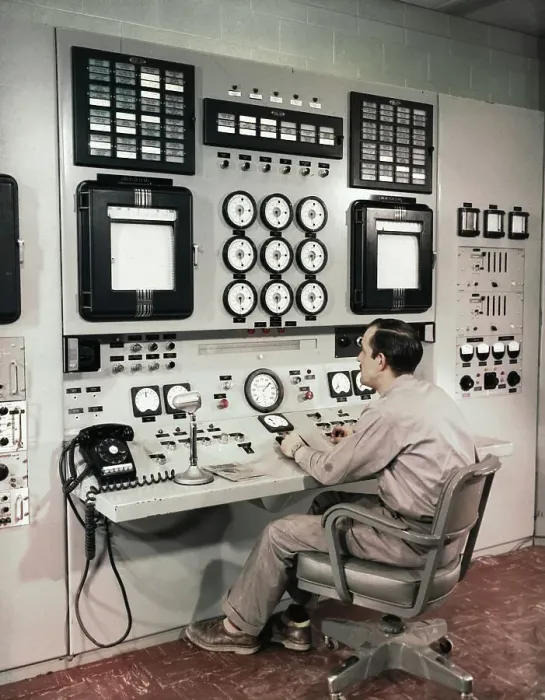 Framed Print : Man Sitting at Control Panel of Nuclear Reactor Framed Print : Man Sitting at Control Panel of Nuclear Reactor