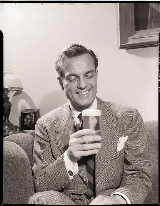 Framed Print : Man Sitting on Couch with Glass of Beer