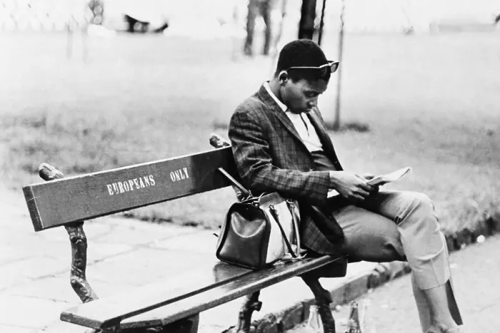 Framed Print : Man Sitting on Europeans Only Bench Framed Print : Man Sitting on Europeans Only Bench