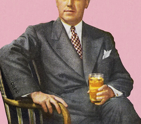 Man Sitting Holding Drink