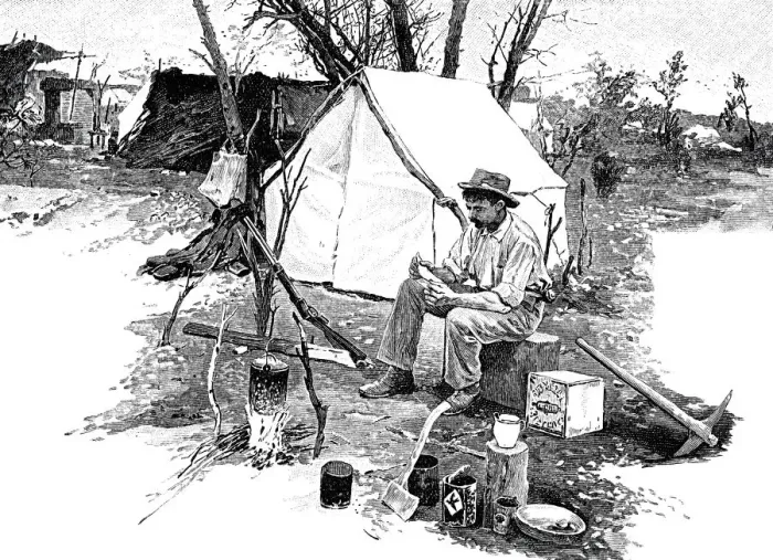 Framed Print : Man sitting outside tent reading a letter Framed Print : Man sitting outside tent reading a letter