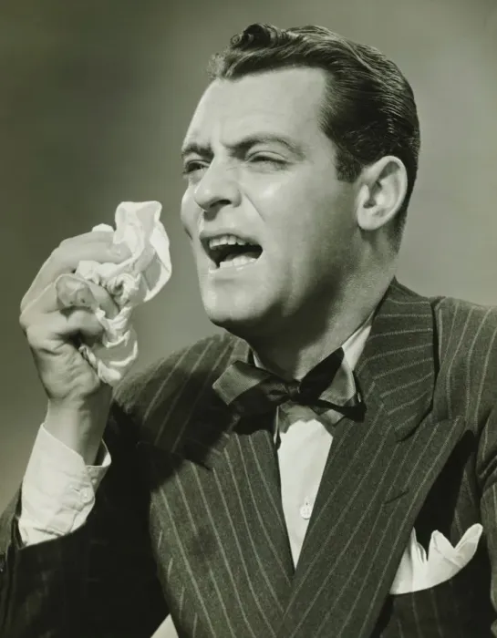 Framed Print : Man sneezing in studio, (B&W) Framed Print : Man sneezing in studio, (B&W)