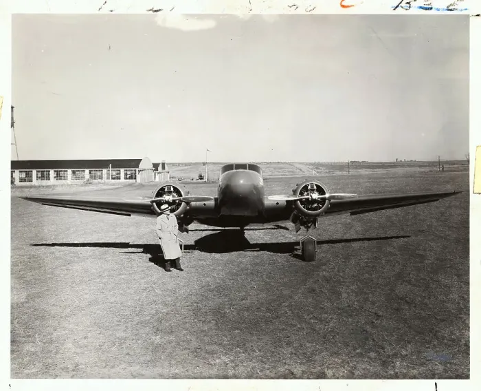 Framed Print : Man Standing with 1930s Aircraft Framed Print : Man Standing with 1930s Aircraft