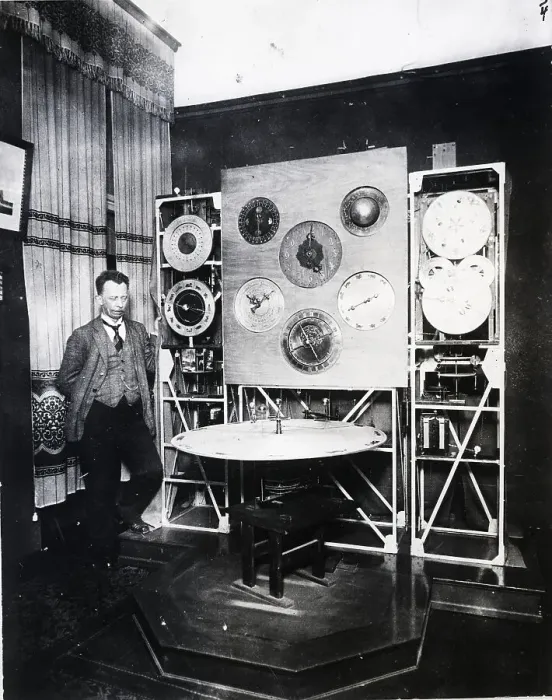 Framed Print : Man Standing Next to Detailed Clock Framed Print : Man Standing Next to Detailed Clock