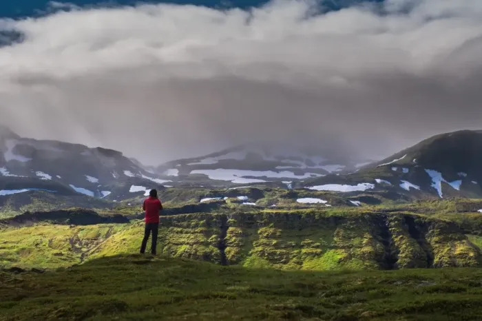 Framed Print : a man standing in front of iceland mountain landscape Framed Print : a man standing in front of iceland mountain landscape