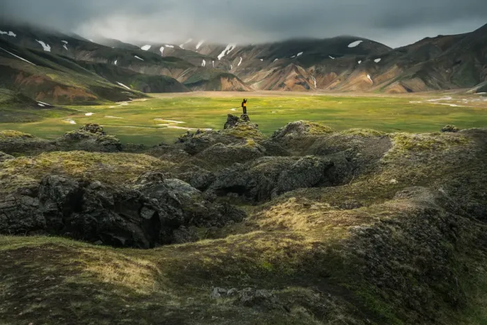 Framed Print : A man standing infront of volcanic landscape Framed Print : A man standing infront of volcanic landscape