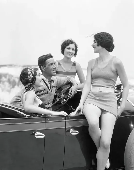 Framed Print : Man at steering wheel of convertible car, surrounded by three women dressed in bathing swim suits, sand dunes on horizon Framed Print : Man at steering wheel of convertible car, surrounded by three women dressed in bathing swim suits, sand dunes on horizon