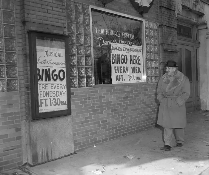 Framed Print : Man Strolls Past Where Bingo Is Played Framed Print : Man Strolls Past Where Bingo Is Played