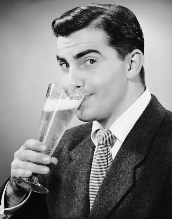 Framed Print : Man in suit drinking tall glass of beer Framed Print : Man in suit drinking tall glass of beer