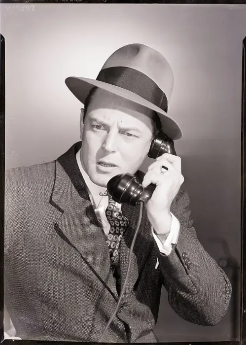 Framed Print : Man in Suit and Hat Using Telephone